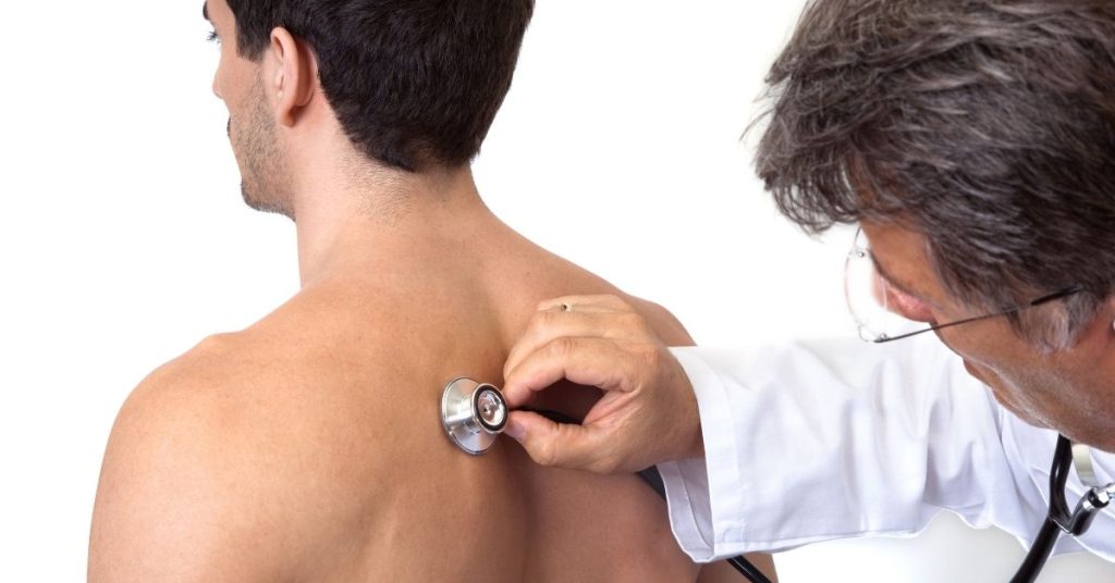 Doctor Giving Man Physical Exam