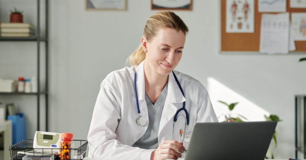 Healthcare provider conducting an online telehealth consultation with a patient about prescription peptide therapy
