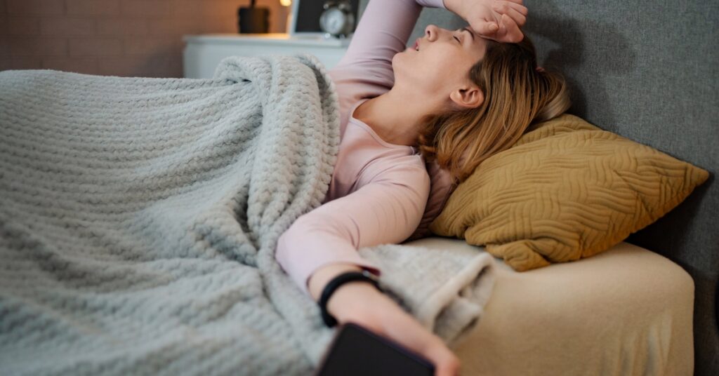 Woman experiencing insomnia and difficulty sleeping at night