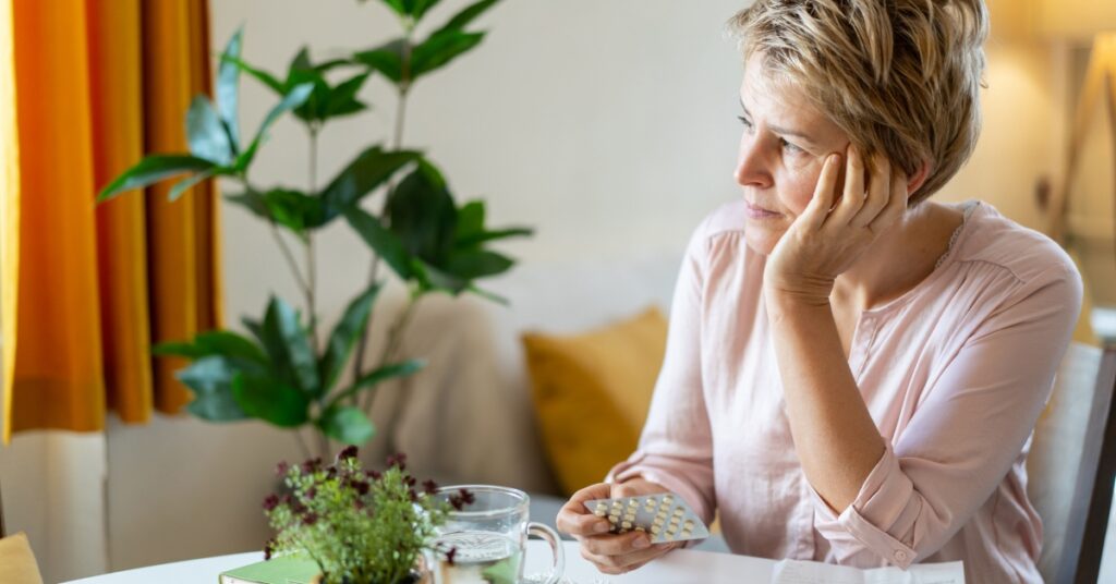 Menopause-aged woman experiencing discomfort related to vaginal dryness symptoms