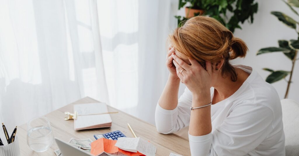 Middle-aged woman experiencing headache discomfort during menopause