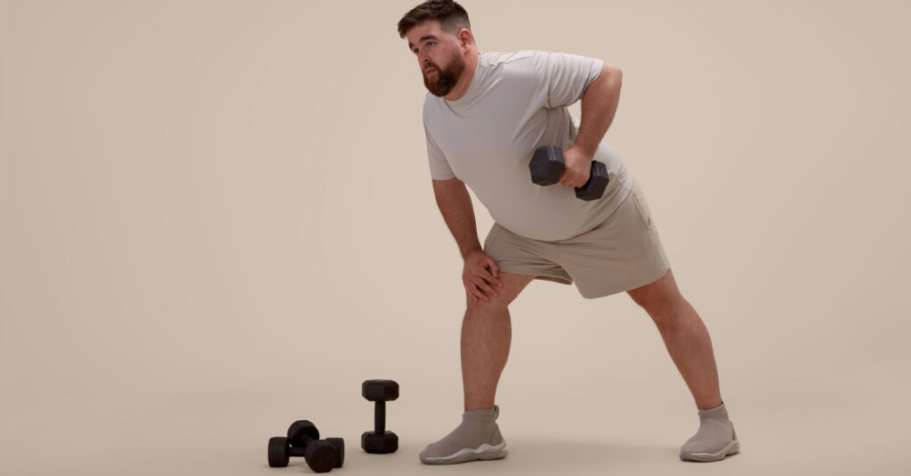 Man exercising in a gym as part of a healthy lifestyle and physician-guided weight management program