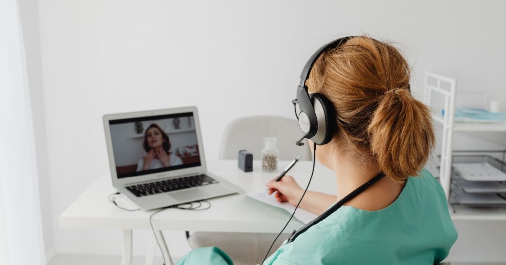 Patient participating in a telehealth appointment with a licensed healthcare provider on a laptop