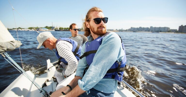 Group of adult men spending time together on a boat
