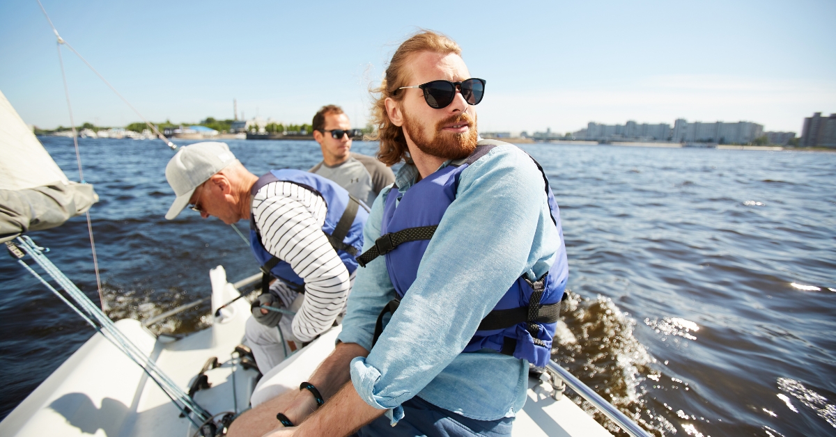 Group of adult men spending time together on a boat